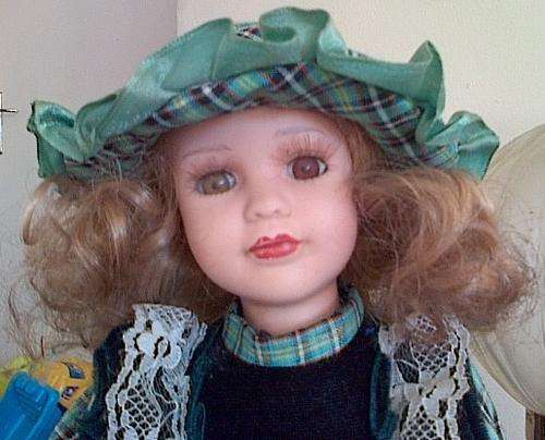 Stunning Porcelain doll - has a stamp of originality
