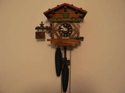 An unusual Hand-Painted Cuckoo Clock in working condition up for R1 - NO RESERVE!!!!!!!!!