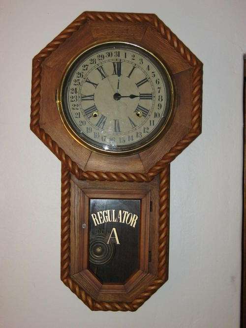 Antique drop-octagan calendar wall clock