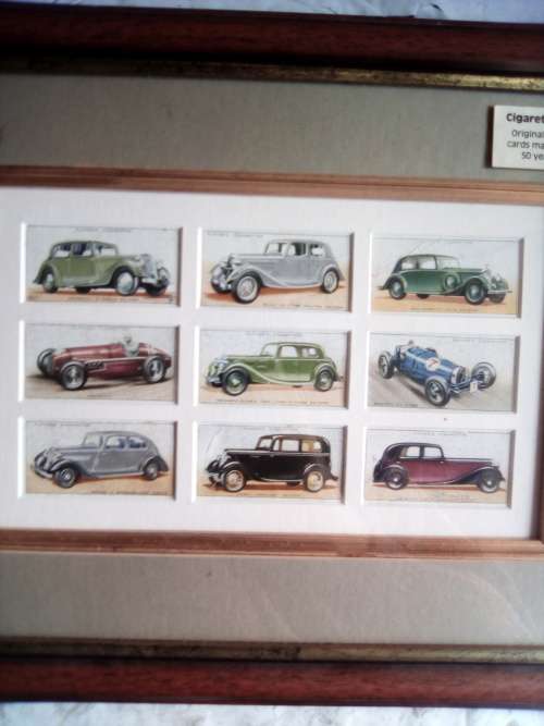 Cigarette cards neatly mounted in smart wooden frames