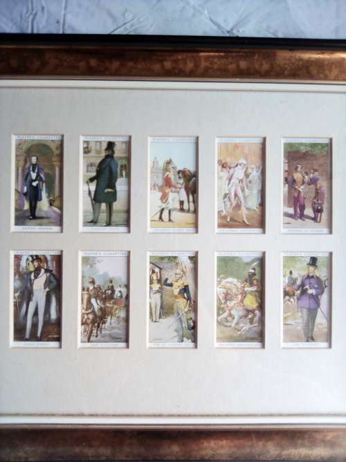Cigarette cards neatly mounted in smart wooden frames