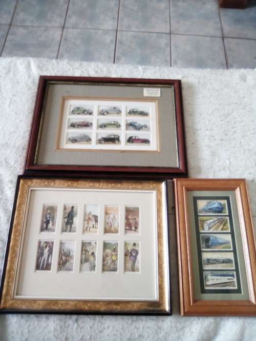 Cigarette cards neatly mounted in smart wooden frames