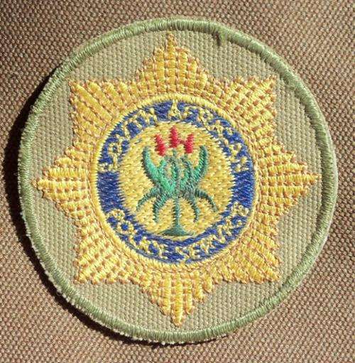 SAP Special Task Force Cap Badge - (sewn-on type) - Original
