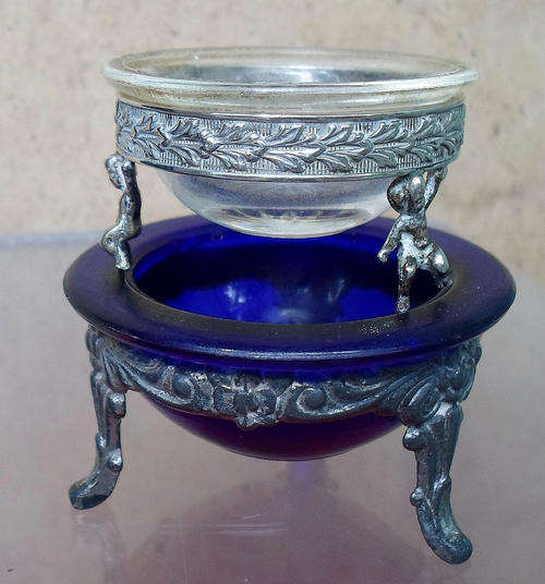 TWO ATTRACTIVE VINTAGE SALT CONTAINERS ON STANDS~ONE CHERUBS