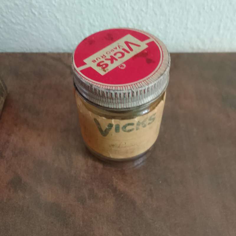 Vintage collectable tins with an old rear Vicks bottel
