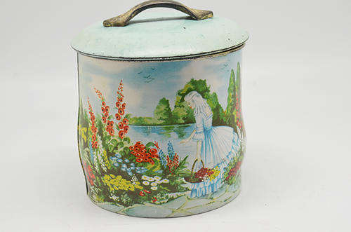 Vintage metal canister with handle on lid