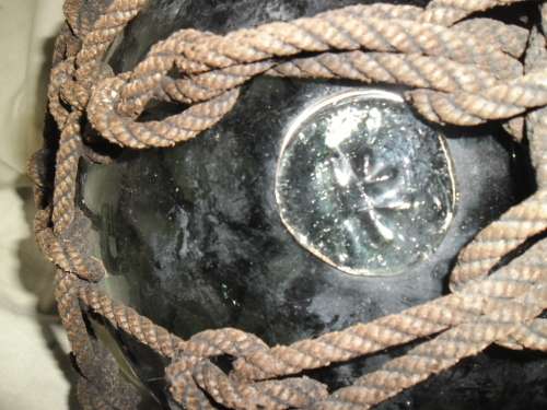 Large  1930's  Japanese Glass Fishing Float with original rope and makers mark.