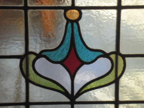 Vintage stained glass window in frame