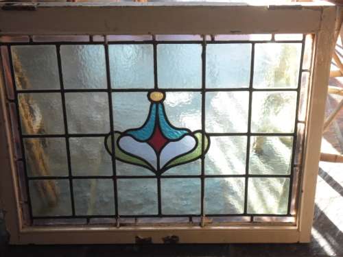 Vintage stained glass window in frame