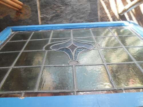 Vintage stained glass window in frame