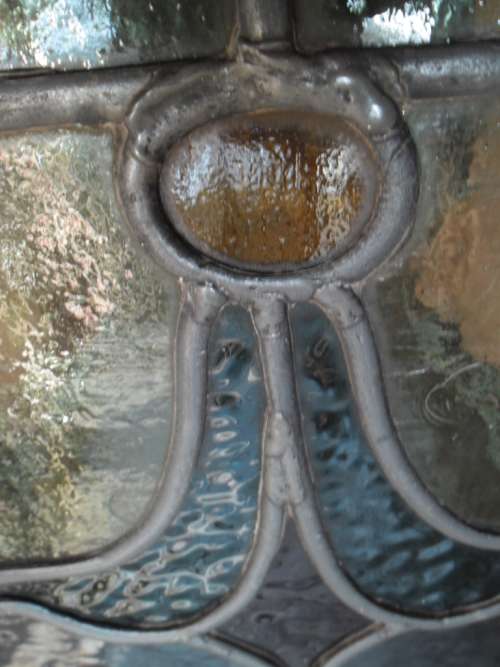 Vintage stained glass window in frame