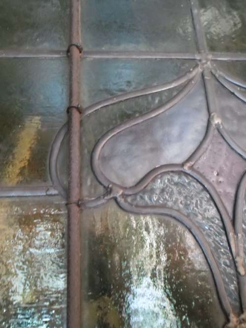 Vintage stained glass window in frame
