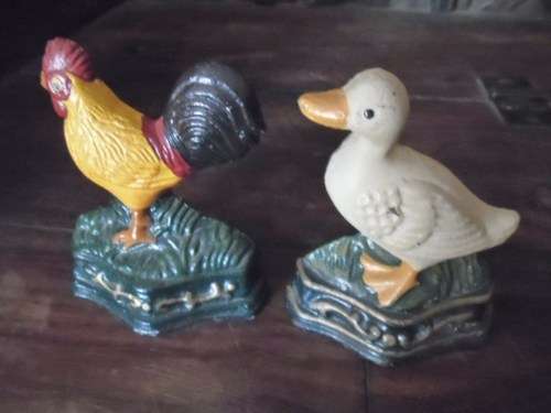 Pair of petite cast metal doorstops. Duck and chicken
