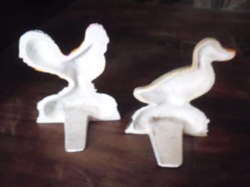 Pair of petite cast metal doorstops. Duck and chicken