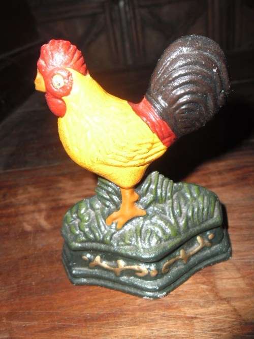Pair of petite cast metal doorstops. Duck and chicken