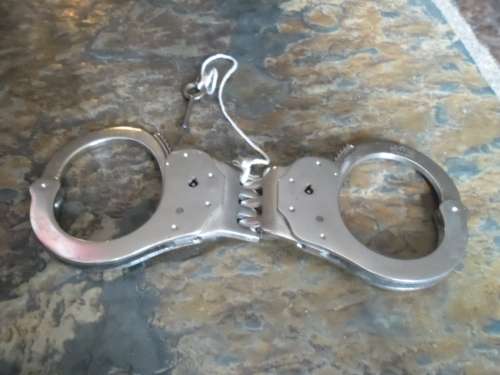Pair of Alcyon Handcuffs with key. Made in Spain