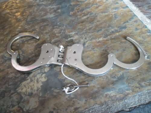 Pair of Alcyon Handcuffs with key. Made in Spain