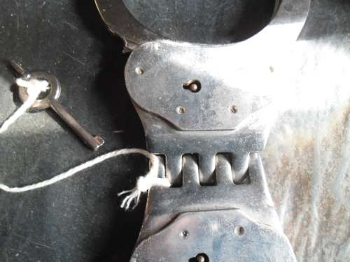 Pair of Alcyon Handcuffs with key. Made in Spain