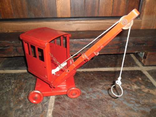 Triang Toys 1930's toy crane with metal wheels.