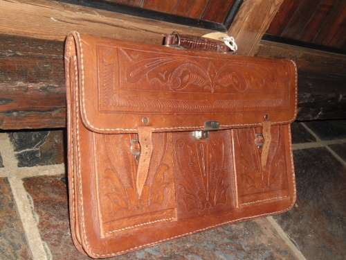 Vintage tooled leather satchel.