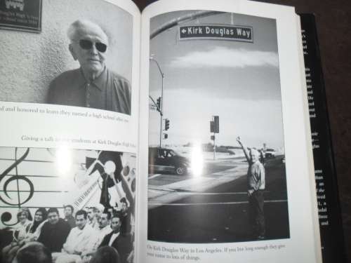 "Let's Face It  90 Years of Living, Loving, and Learning"  by Kirk Douglas.  Signed copy !