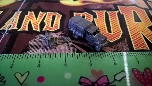 Tiny lead Opel Blitz truck with artillery piece