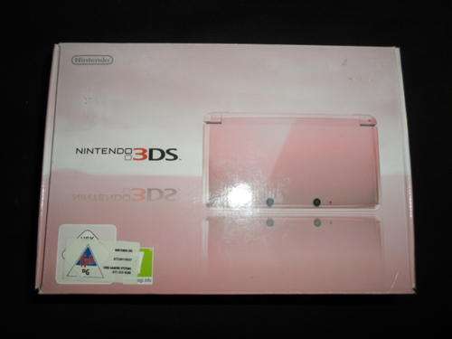 Pink Nintendo 3DS in box with games