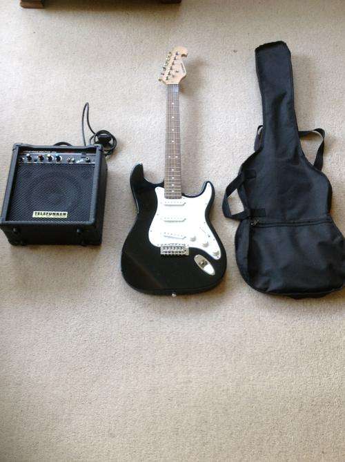 Electric guitar with the bag, amp and all the cables