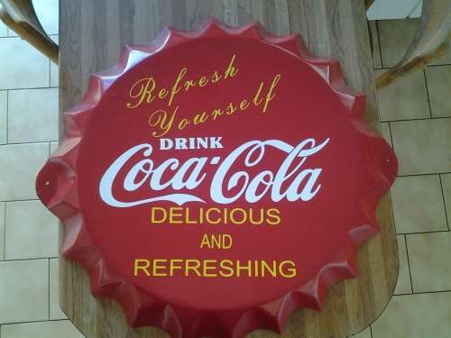 coca cola bottle cap sign