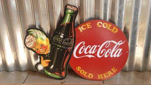 Large Coca Cola sprite boy sign.