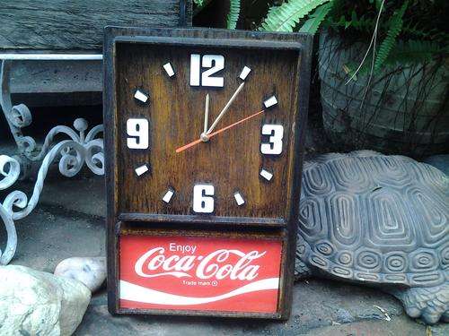 Antique Looking Coca Cola Clocks, with glass advertising sign.