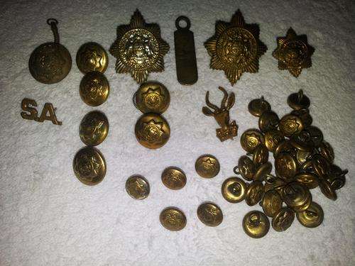 lot of badges pins and buttons