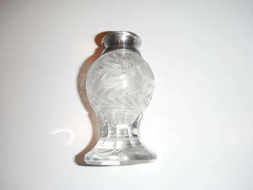 a beautiful piece glass with sterling silver lid