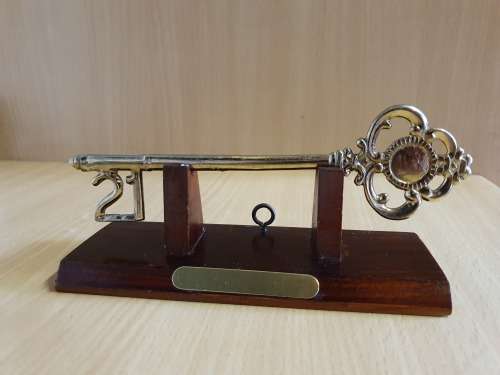 21st Keyring on a Wooden Stand