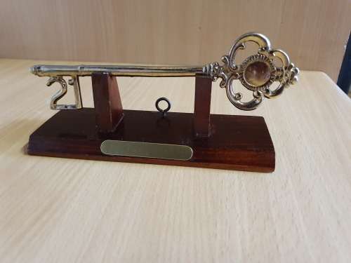 21st Keyring on a Wooden Stand