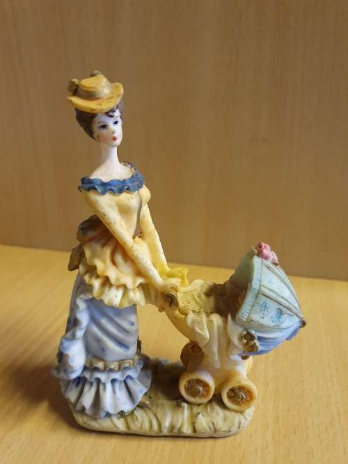 Female Figurine with Pram & Baby