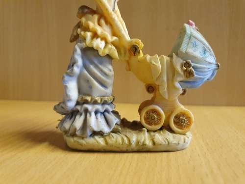 Female Figurine with Pram & Baby
