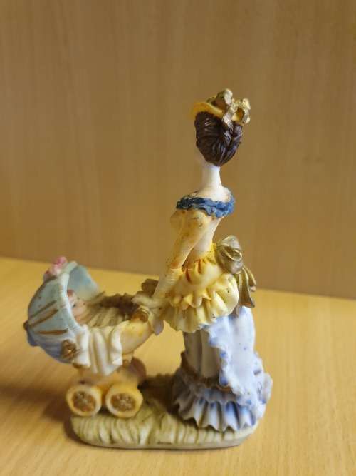 Female Figurine with Pram & Baby