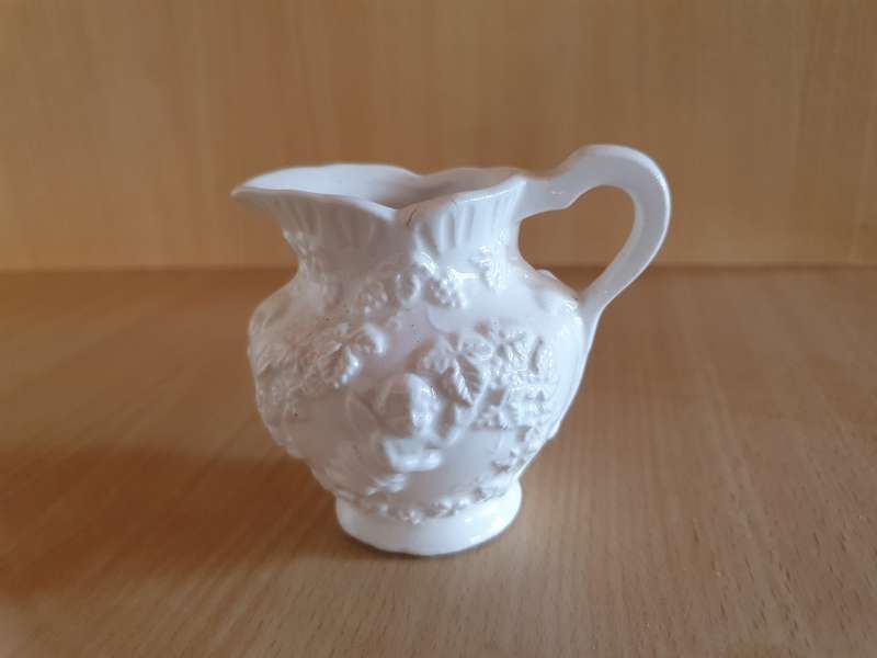 Small White Embossed Angel Figurine Ceramic Milk Jug - width 10cm height 8cm