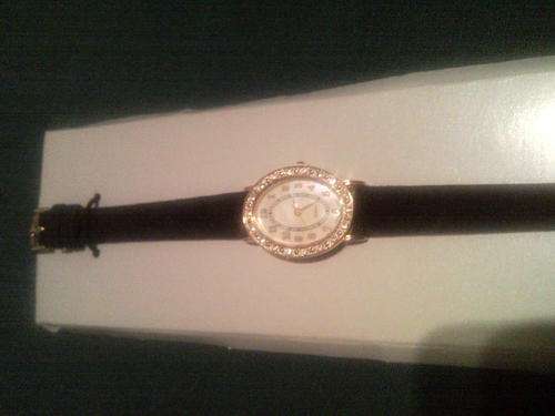 GOLD & BLACK WATCH FROM AVON WITH SWAROWSKY & MOTHER PEARL