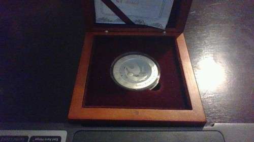 1oz Silver coin with certificate and wooden box
