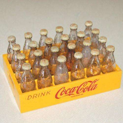 24 Miniature Coca Cola bottles in a plastic crate - Bottle height 65mm - Crate 150mm X 100mm