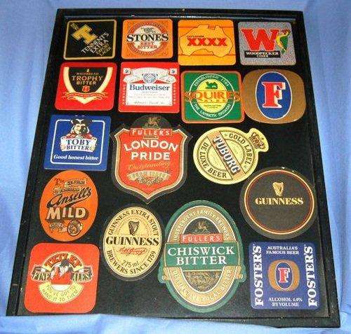 17 Collectable Bar Coasters Framed Under Glass. - Size  520mm X 420mm