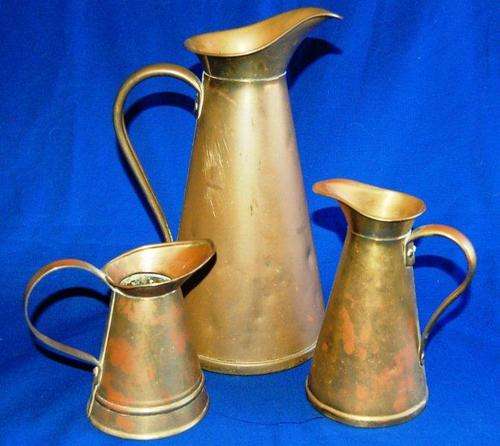 3 Vintage Brass Water Jugs - ( 2 by J.S. & S England ) Sizes 290mm. 170mm. 130mm
