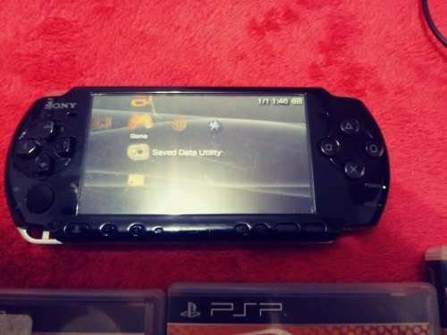 PSP 3000 good condition with 4 games