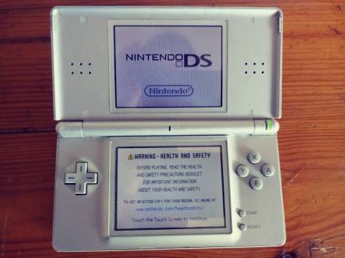 Nintendo DS grey( very used condition) works well. Read below.