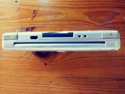 Nintendo DS grey( very used condition) works well. Read below.
