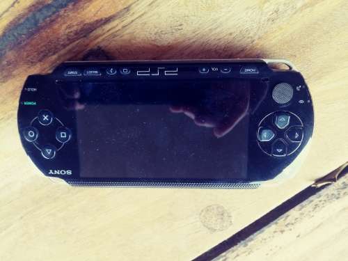 PSP 1000 ( Fair condition) with 8 games