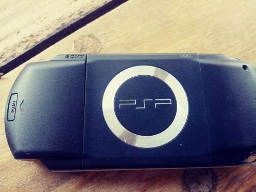 PSP 1000 ( Fair condition) with 8 games