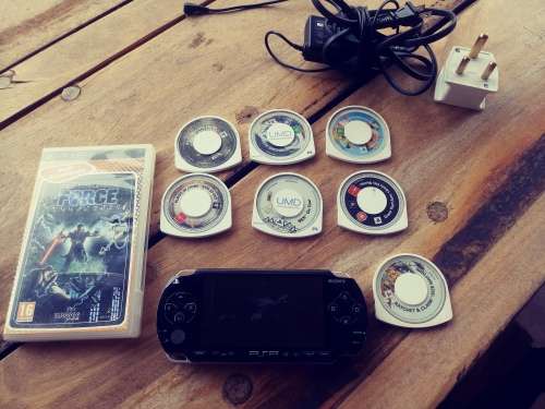 PSP 1000 ( Fair condition) with 8 games
